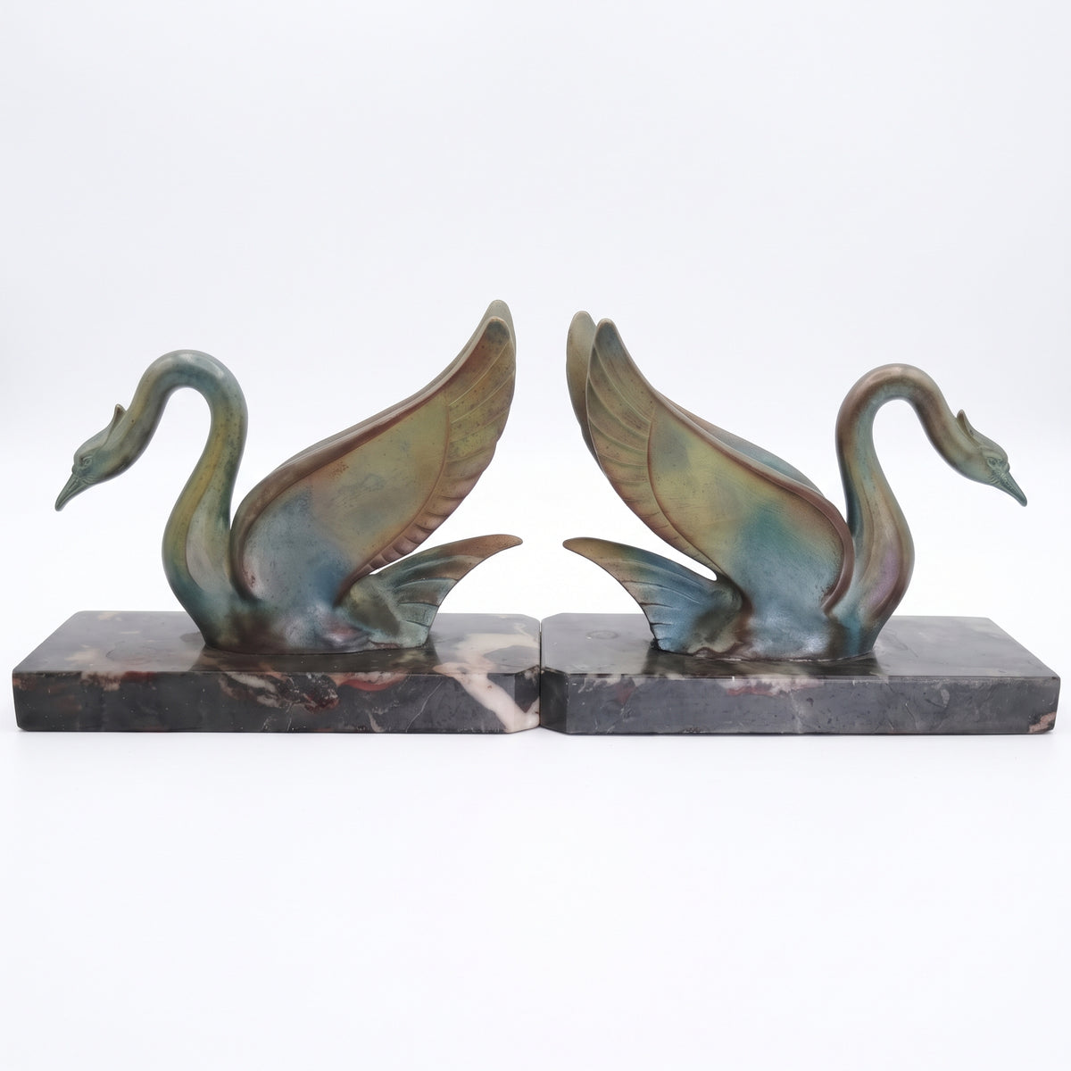 LM-E-278 — Original Art Deco swan bookend pair, symmetrical white studio photograph
