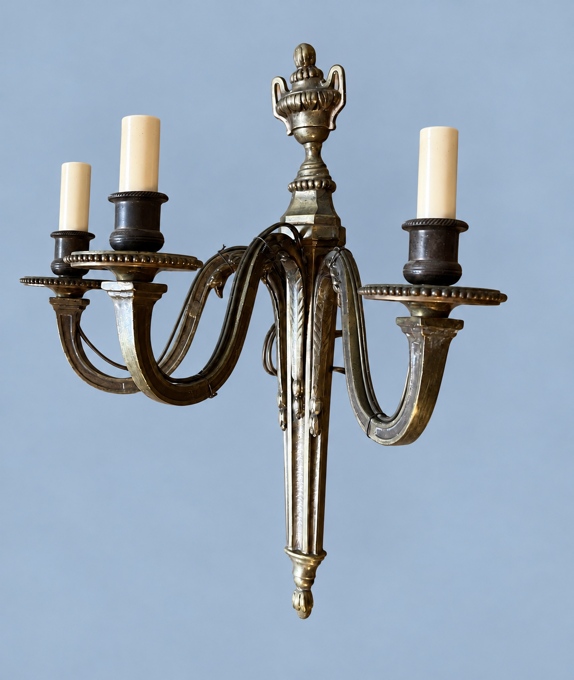 Vintage Pair of Louis XVI Style Three-Arm Bronze-Tone Wall Sconces with Urn Finials
