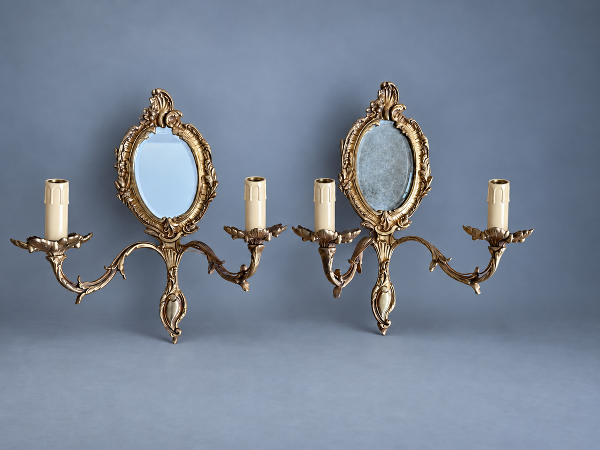 Vintage Pair of Rocaille Style Mirror Wall Sconces, Oval Bevelled Mirrors in Gilt Metal Frames, Leafy Two-Light Arms