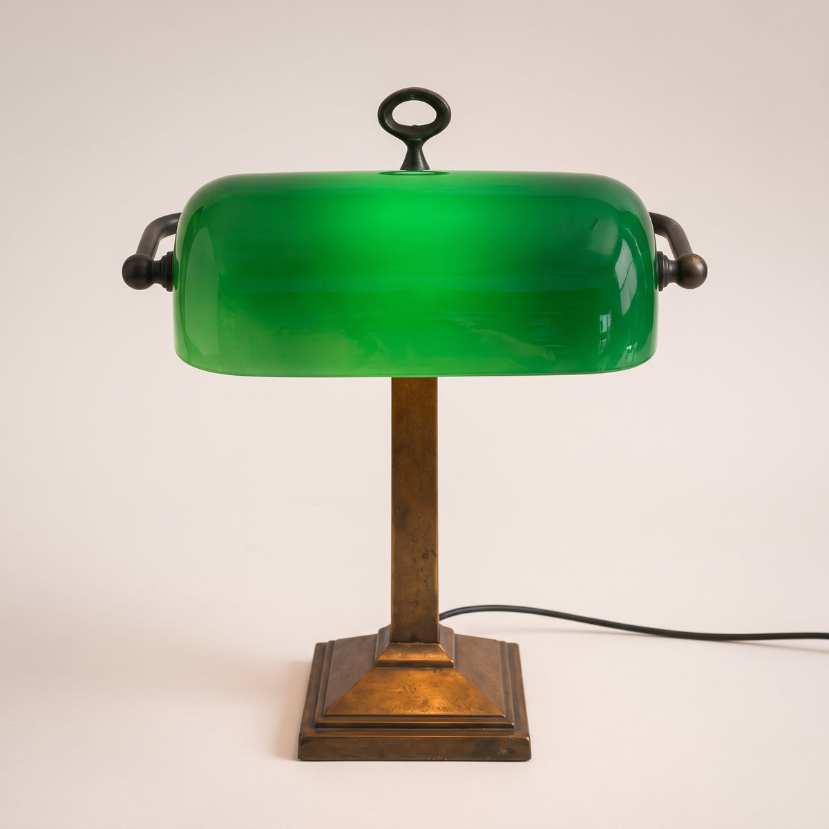 LM-V-063 — Original green glass banker's lamp, warm white symmetrical studio photograph