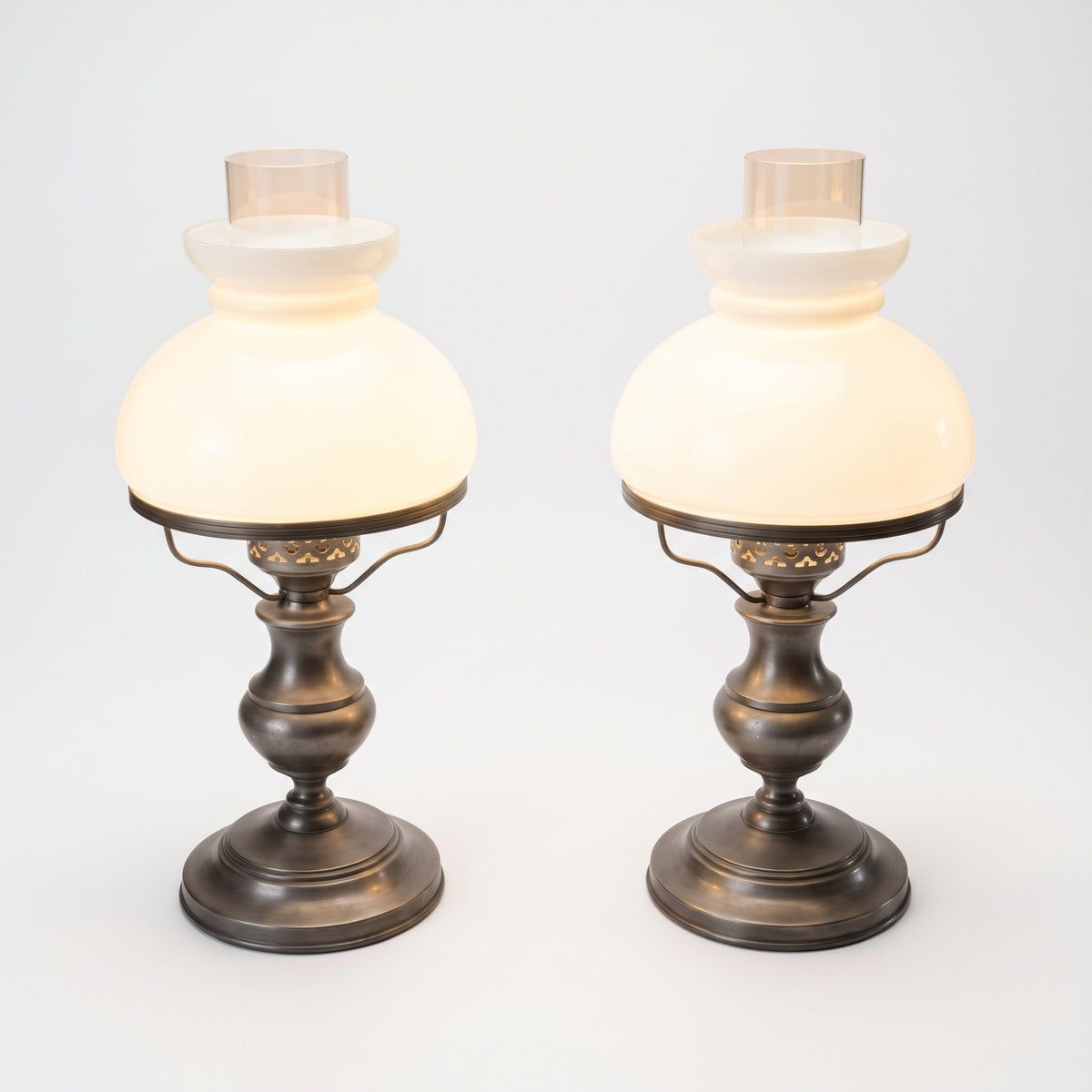 LM-V-398 — Pair of original opal glass lamps with warm glow, symmetrical white studio photograph