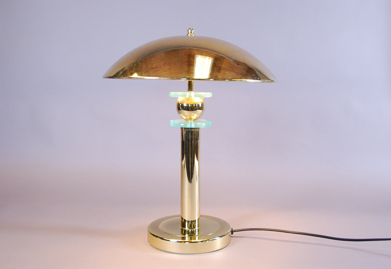 Elegant vintage mushroom lamp featuring a polished brass finish and a distinctive mushroom-shaped shade. This mid-century modern table lamp adds a touch of retro charm to any room, making it perfect for bedside tables, desks, or reading nooks. Its warm, ambient light creates an inviting atmosphere, while the compact design ensures it fits seamlessly into various interior spaces.