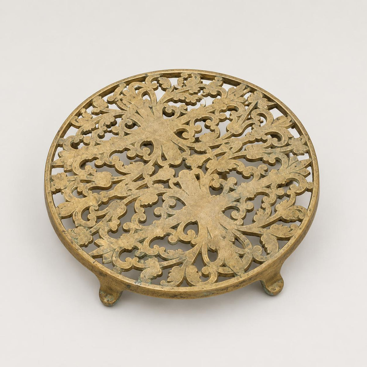 Vintage Pierced Brass-Toned Round Trivet, Footed Openwork Floral Design
