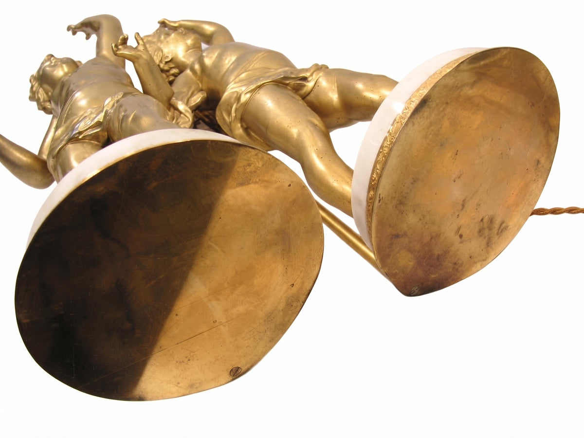 Pair of French Gilt Putti Table Lamps, Winged Cherub Figures on White Marble Bases — France, Early 20th Century