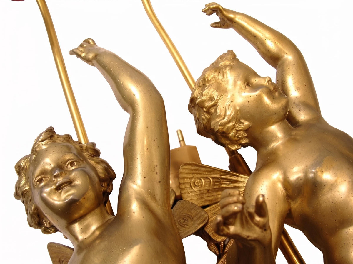 Pair of French Gilt Putti Table Lamps, Winged Cherub Figures on White Marble Bases — France, Early 20th Century
