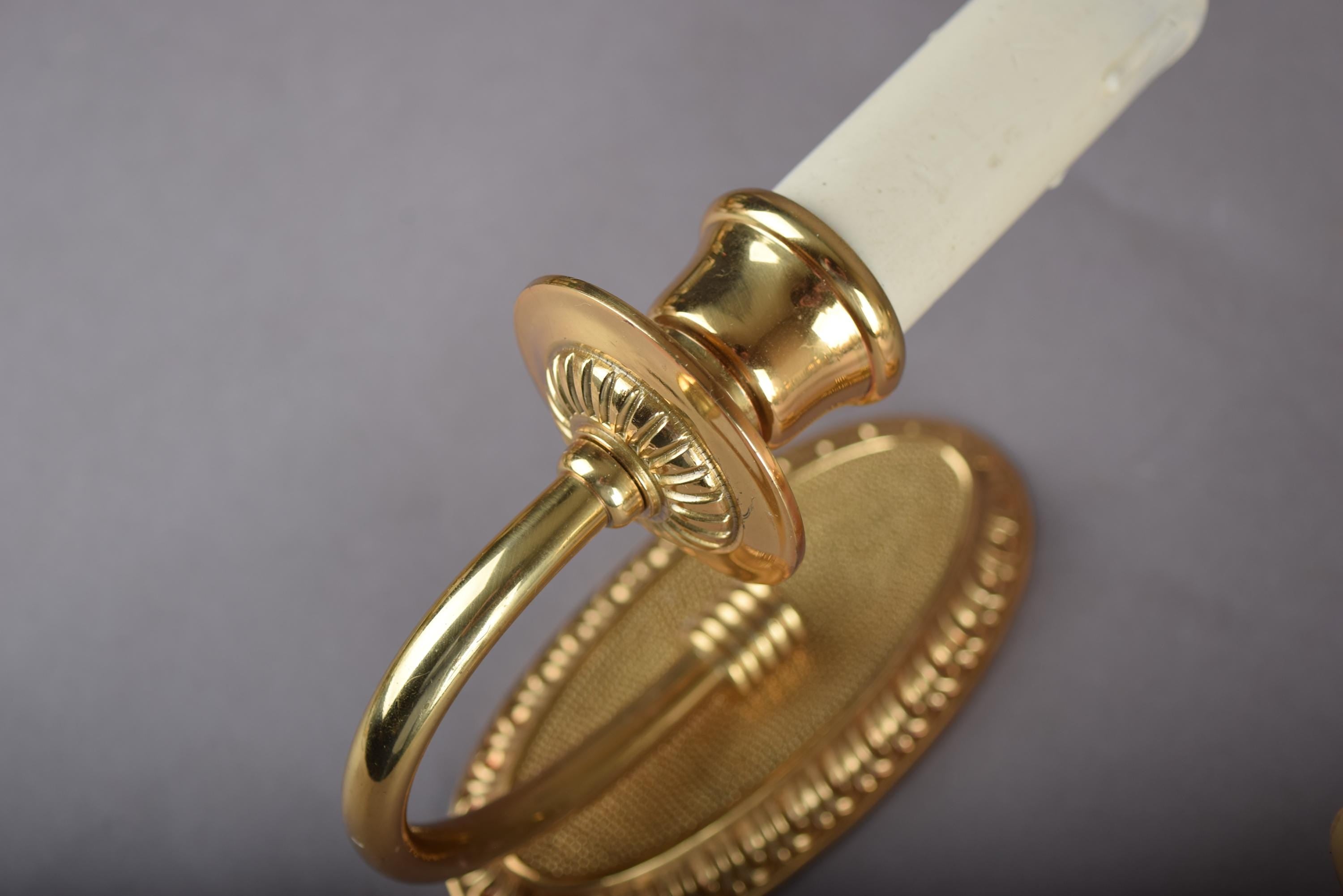 Louis XVI Style Wall Sconces Set of Three, Gilt Metal Single Arm Sconces with Oval Beaded Backplates
