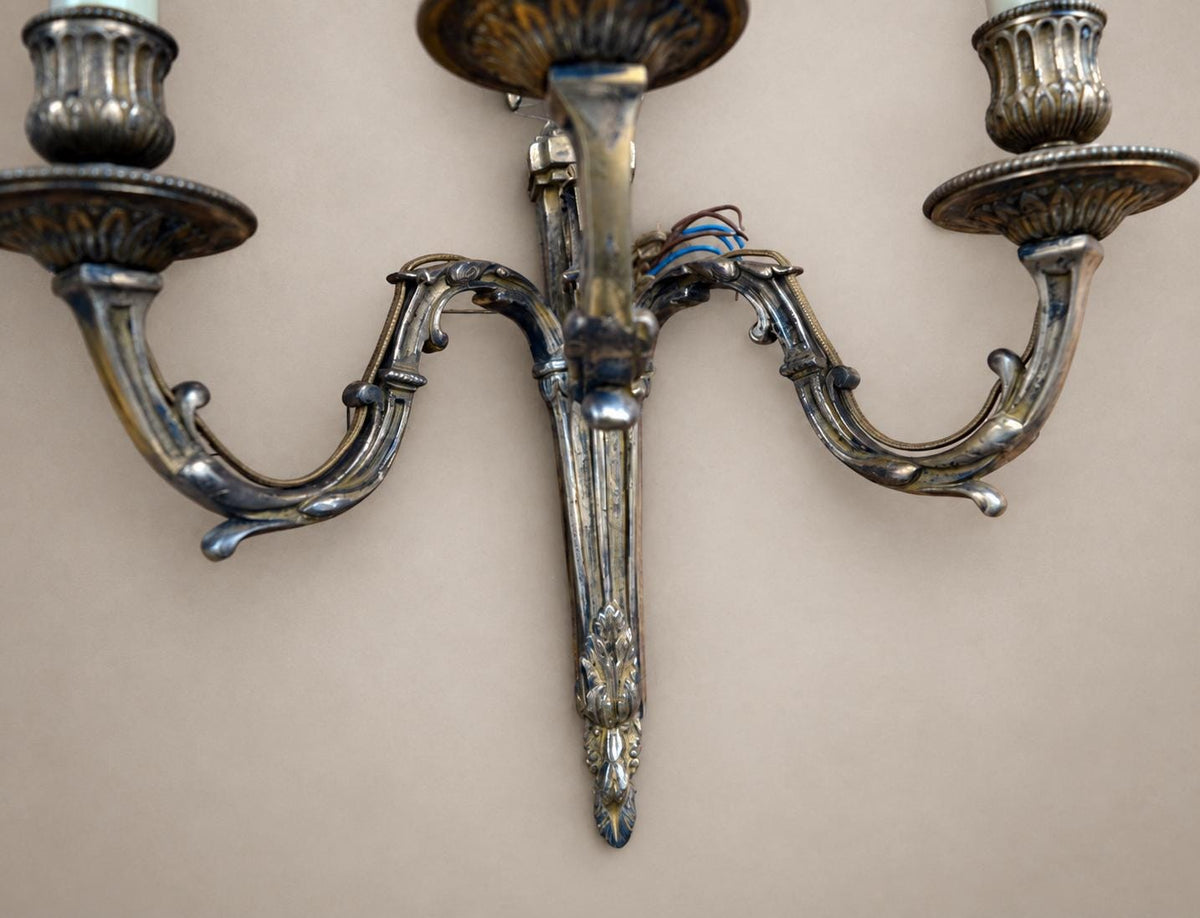 Pair of French Neoclassical Style Patinated Metal Three-Light Wall Sconces Mid 20th