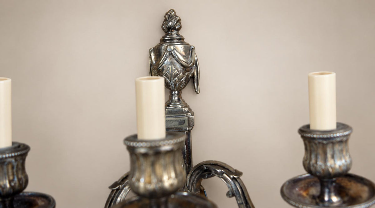 Pair of French Neoclassical Style Patinated Metal Three-Light Wall Sconces Mid 20th