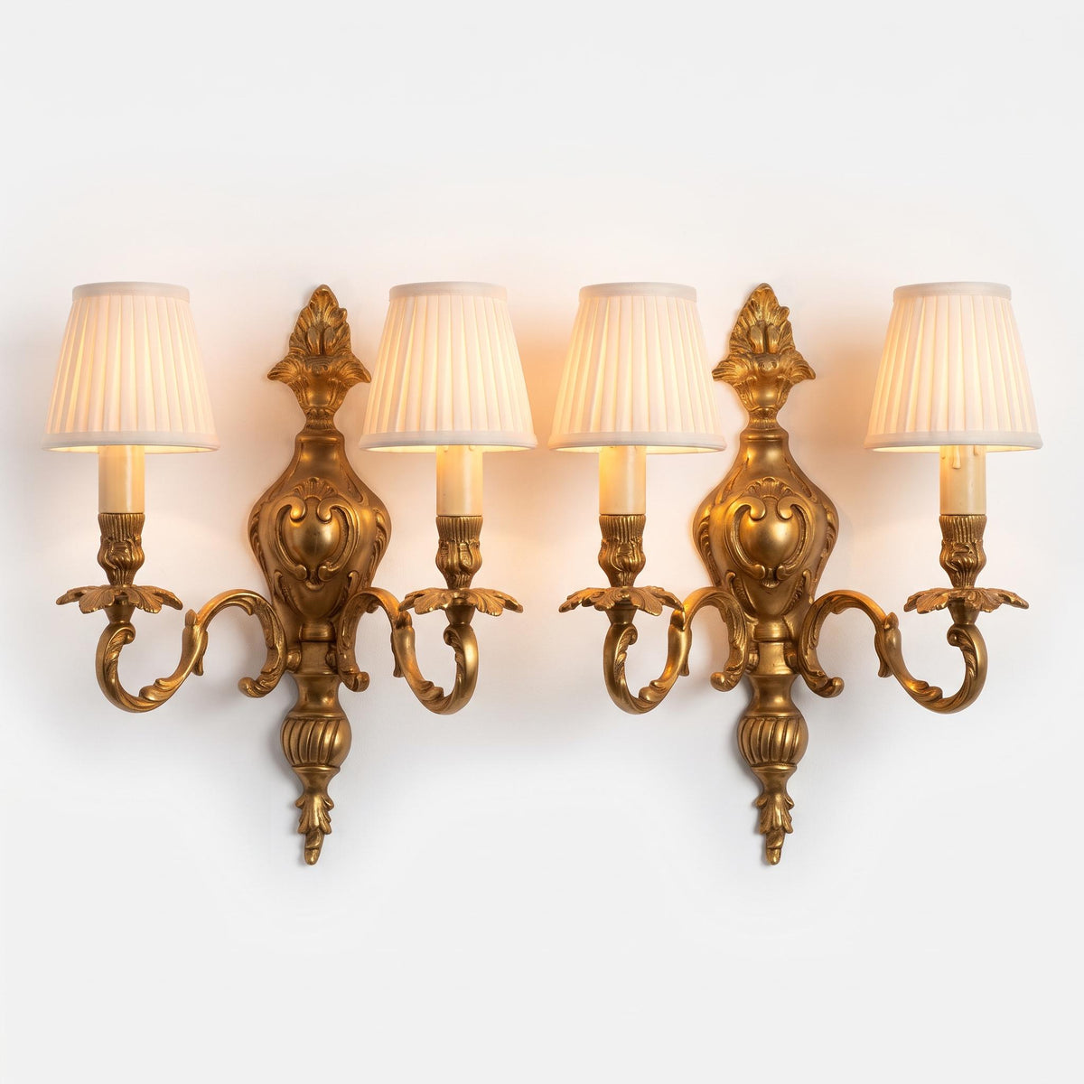 Pair of French Gilt Bronze Two-Arm Wall Sconces, Louis XV Rocaille Style — France, Early 20th Century
