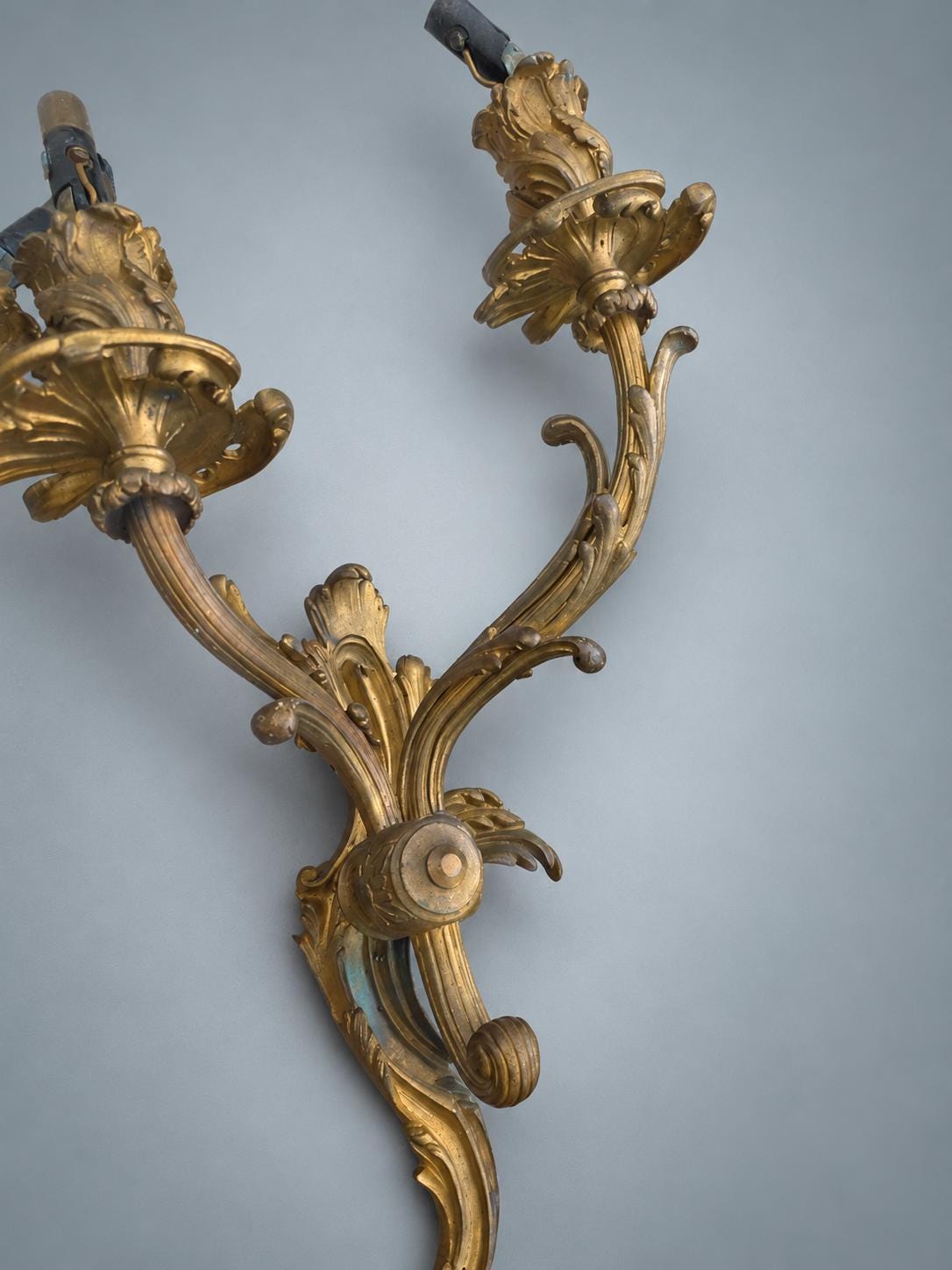 Pair of French Gilt Bronze Two-Arm Wall Sconces, Louis XV Rocaille — France, Early 20th Century