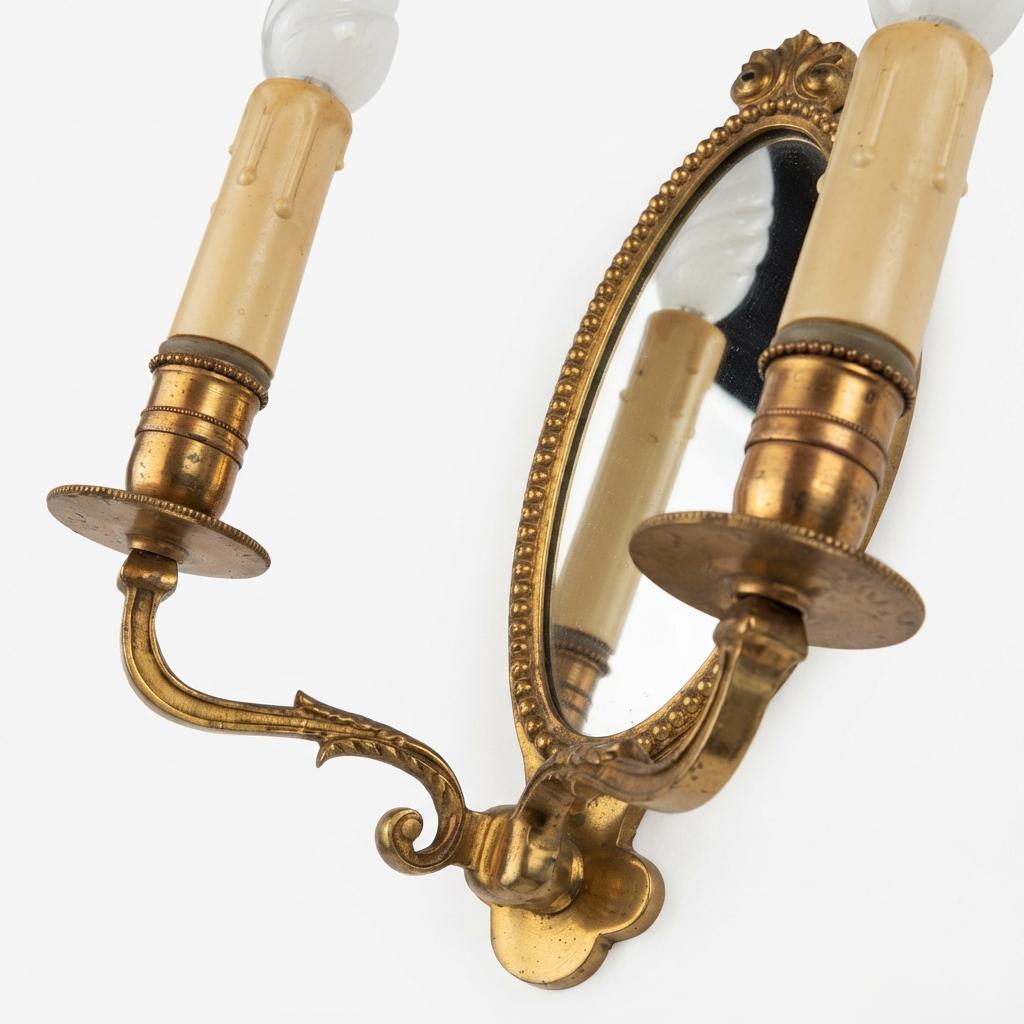 Pair of French Vintage Gilt Brass Wall Sconces, Two Arm with Oval Mirror Backplate — France, Mid-20th Century