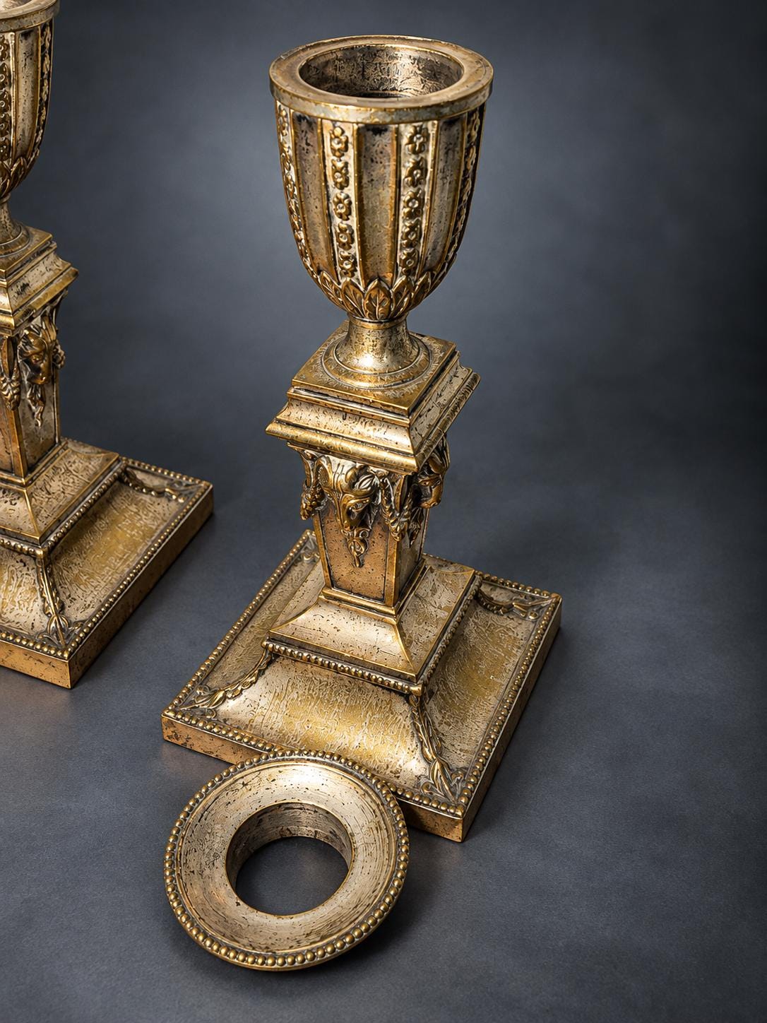 Pair of Neoclassical Candlesticks, Silver-Tone Metal with Ram's Heads and Garlands, Fluted Urn Sconces, Warm Worn Finish