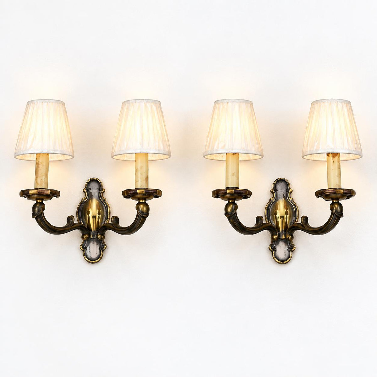 Pair of French Patinated Brass Two-Arm Wall Sconces, with White Fabric Shades — France, circa 1950