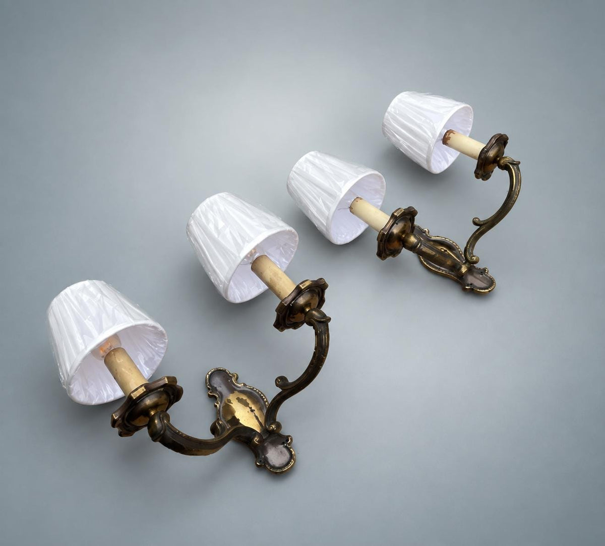 Pair of French Patinated Brass Two-Arm Wall Sconces, with White Fabric Shades — France, circa 1950