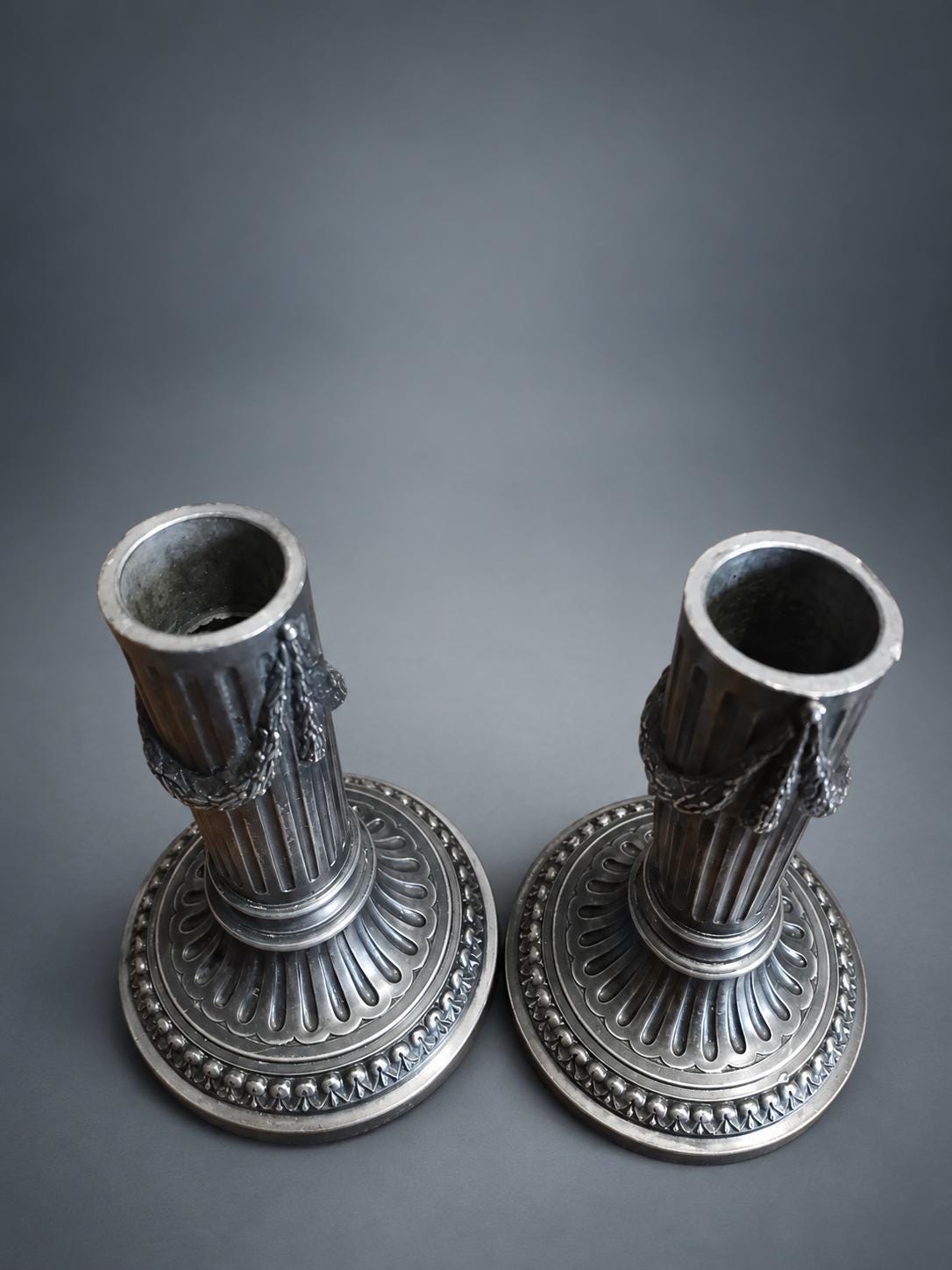 Pair of Napoleon III Style Column Candlesticks, Silver-Tone Metal, Fluted Stems with Ribbon-Tied Garlands, Gadrooned Bases