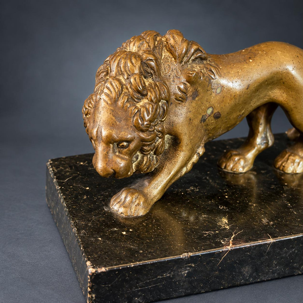 Grand Tour Style Walking Lion Figure, Patinated Gold-Tone Metal on Black Speckled Base, Desk Ornament or Paperweight