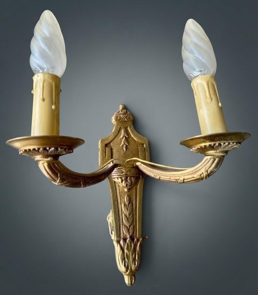 Pair of Louis XVI Style Two-Arm Wall Sconces, Gilt Metal with Acanthus Arms and Shield-Shaped Back Plates