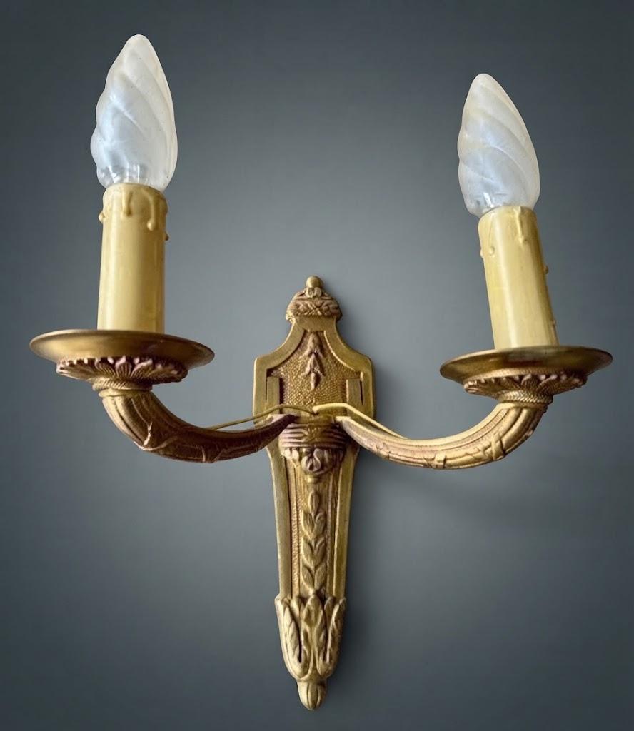Pair of Louis XVI Style Two-Arm Wall Sconces, Gilt Metal with Acanthus Arms and Shield-Shaped Back Plates