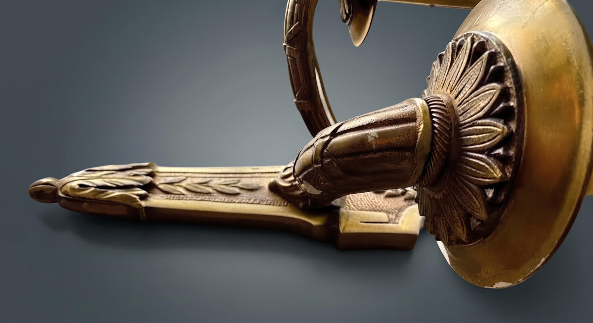 Pair of Louis XVI Style Two-Arm Wall Sconces, Gilt Metal with Acanthus Arms and Shield-Shaped Back Plates