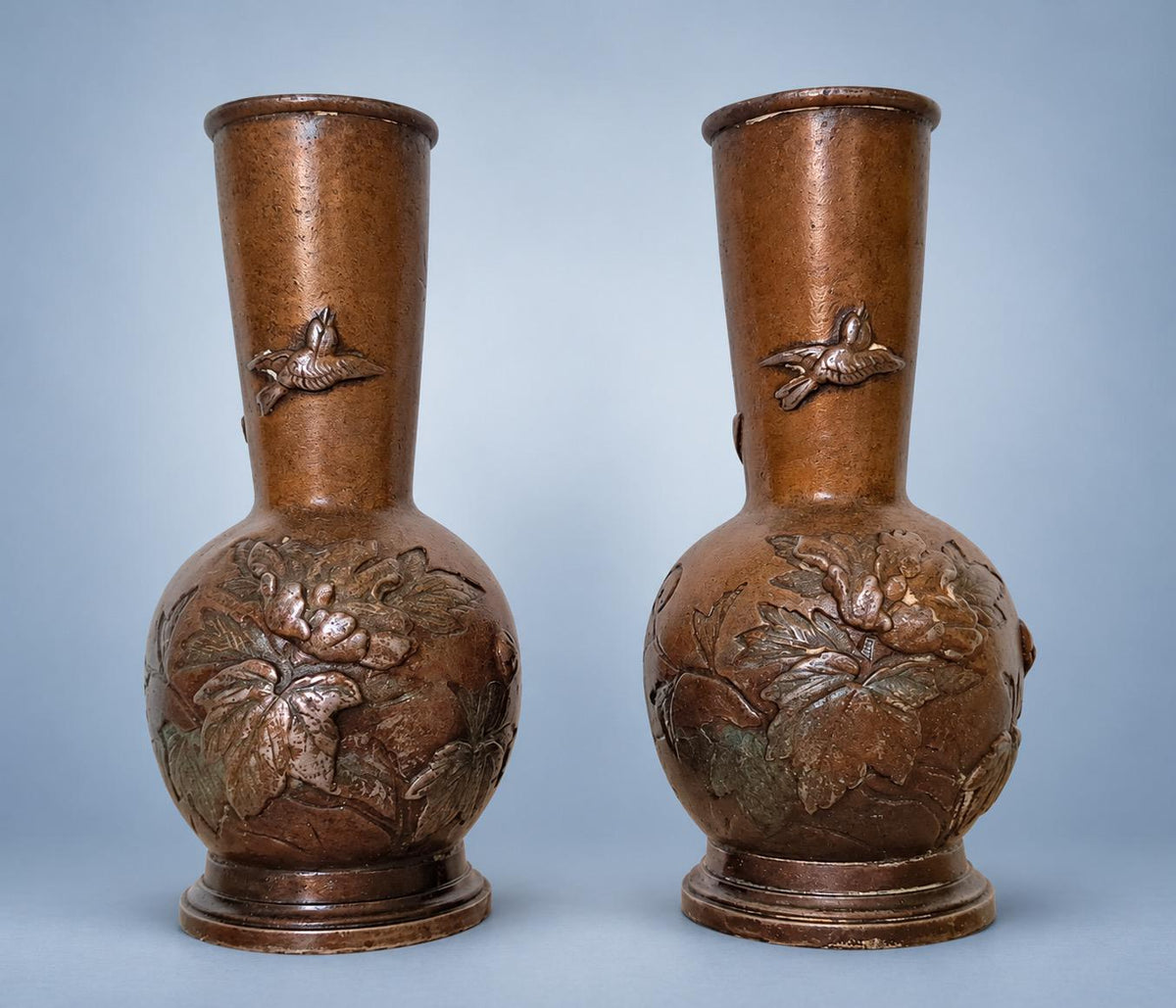 Antique Pair of Small Meiji Style Patinated Metal Bottle Vases, Peonies and Flying Birds in Relief