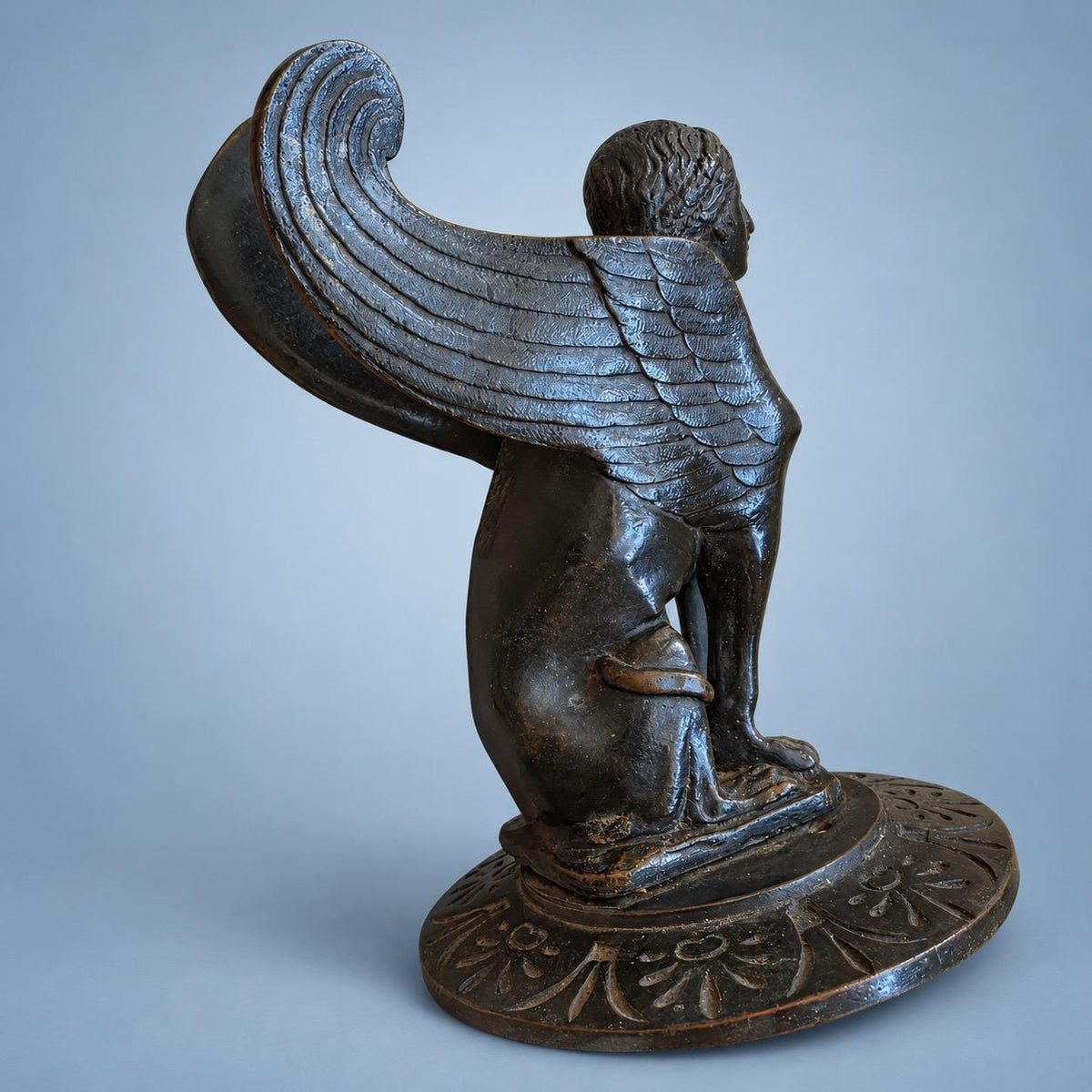 Vintage Pair of Neoclassical Style Winged Sphinx Figures, Patinated Metal on Palmette Bases, Sold as Bookends