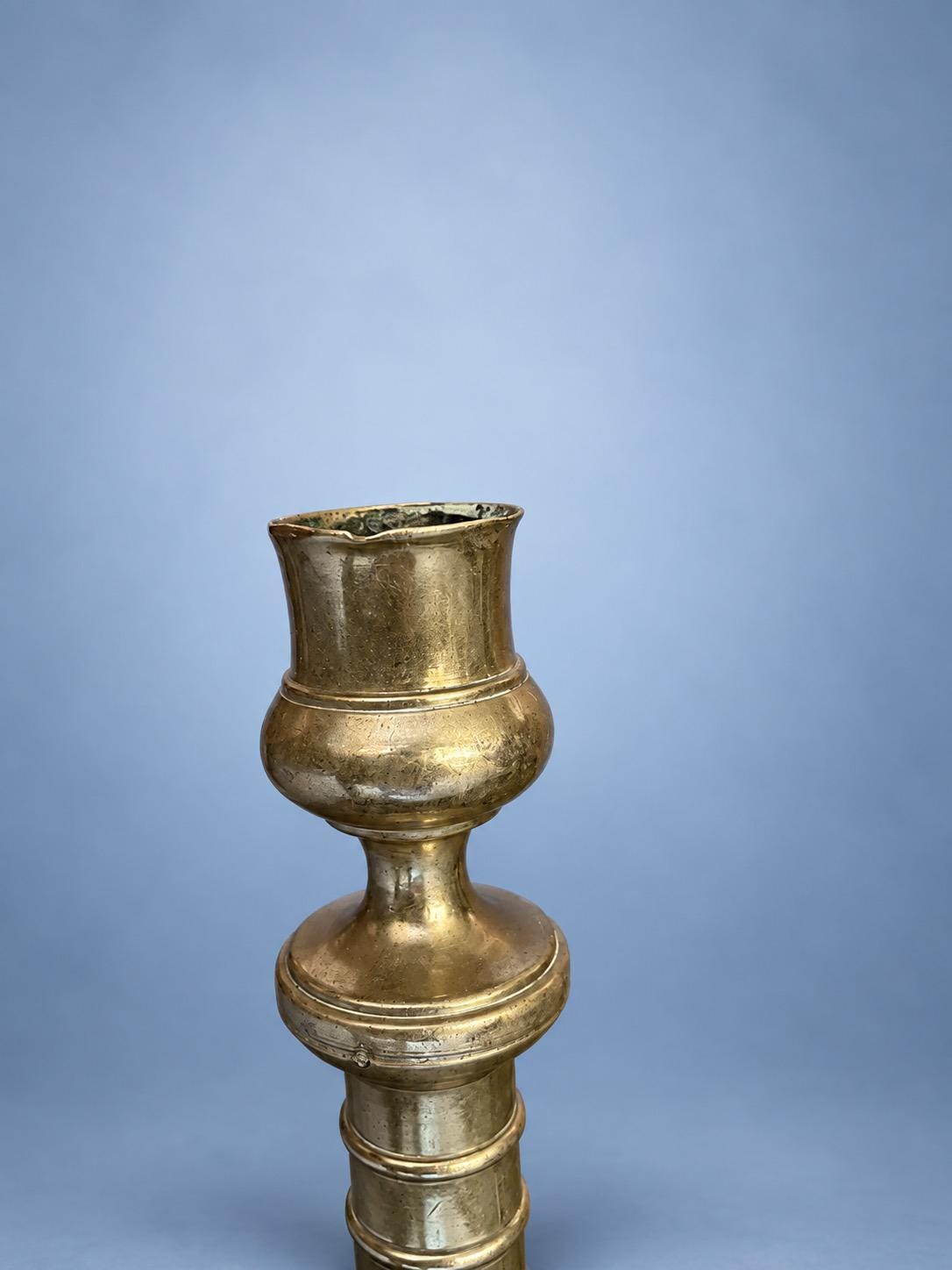 Antique Pair of Empire Style Brass-Tone Candlesticks with Ringed Shafts and Chased Diaper Bands, 19th Century