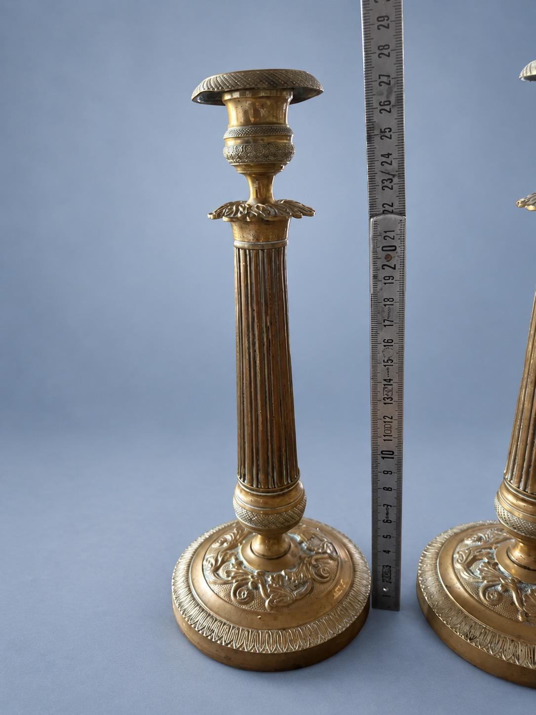 Vintage Pair of Empire Style Patinated Brass-Tone Candlesticks, Fluted Columns, Acanthus Collars and Foliate Bases