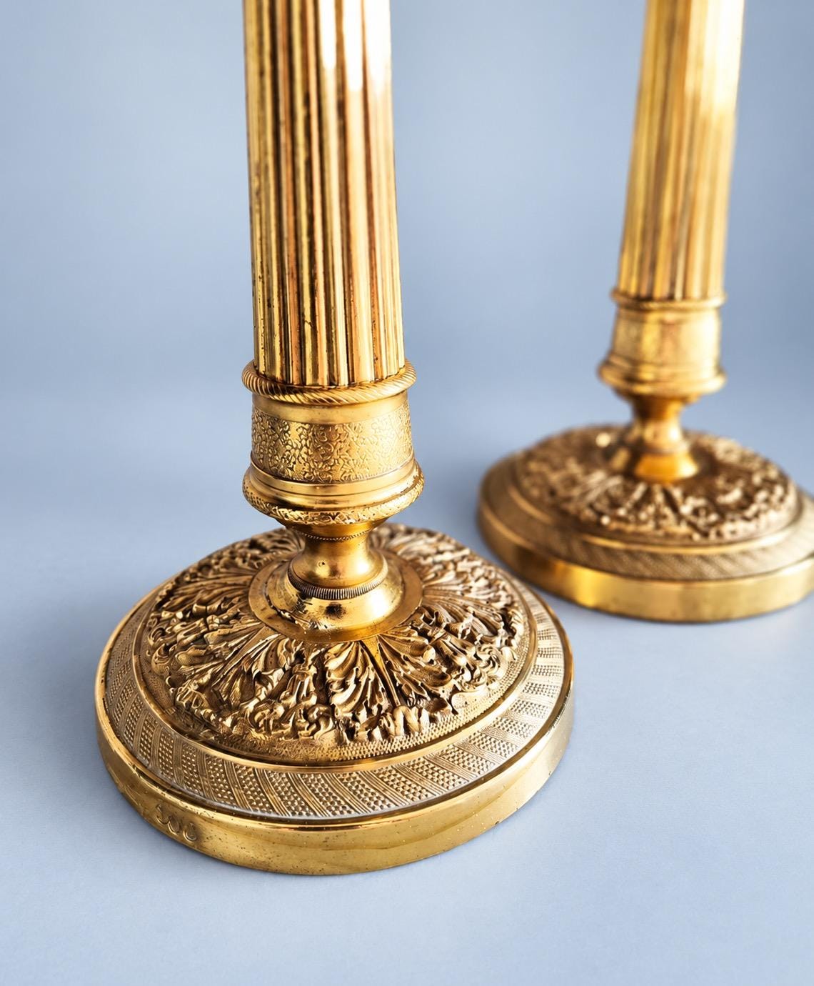 Vintage Pair of Empire Style Brass-Tone Candlesticks, Fluted Columns and Foliate Domed Bases