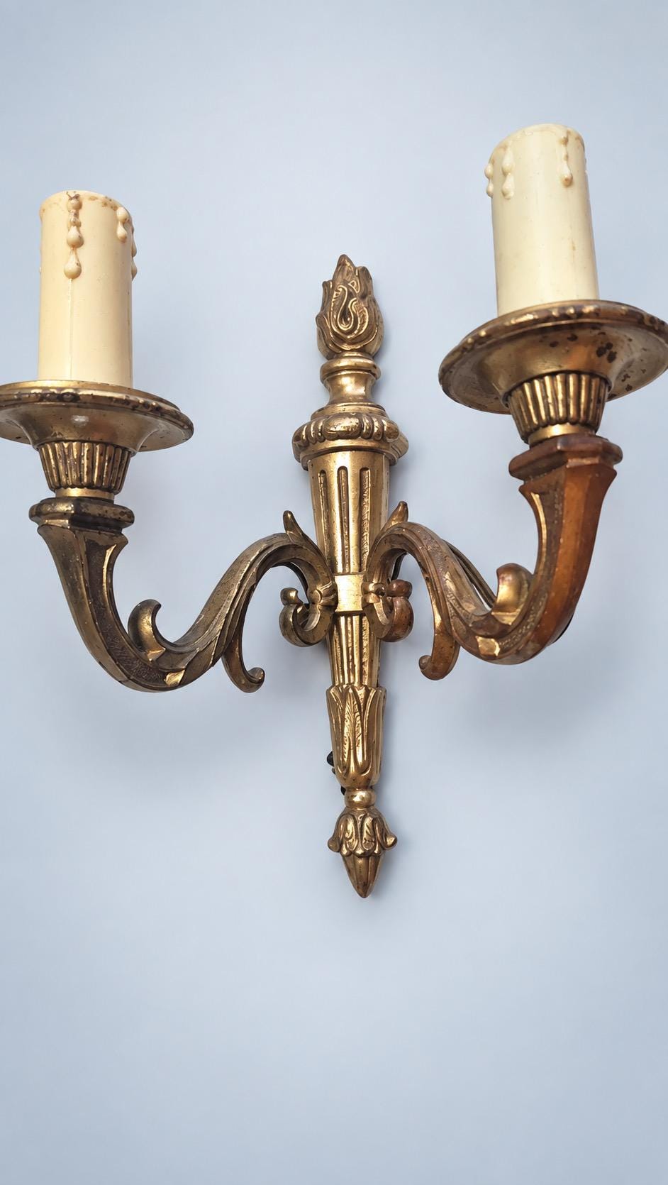Vintage Pair of Louis XVI Style Two-Arm Wall Sconces, Patinated Brass-Tone Metal with Torch Back Plates and Acanthus Arms