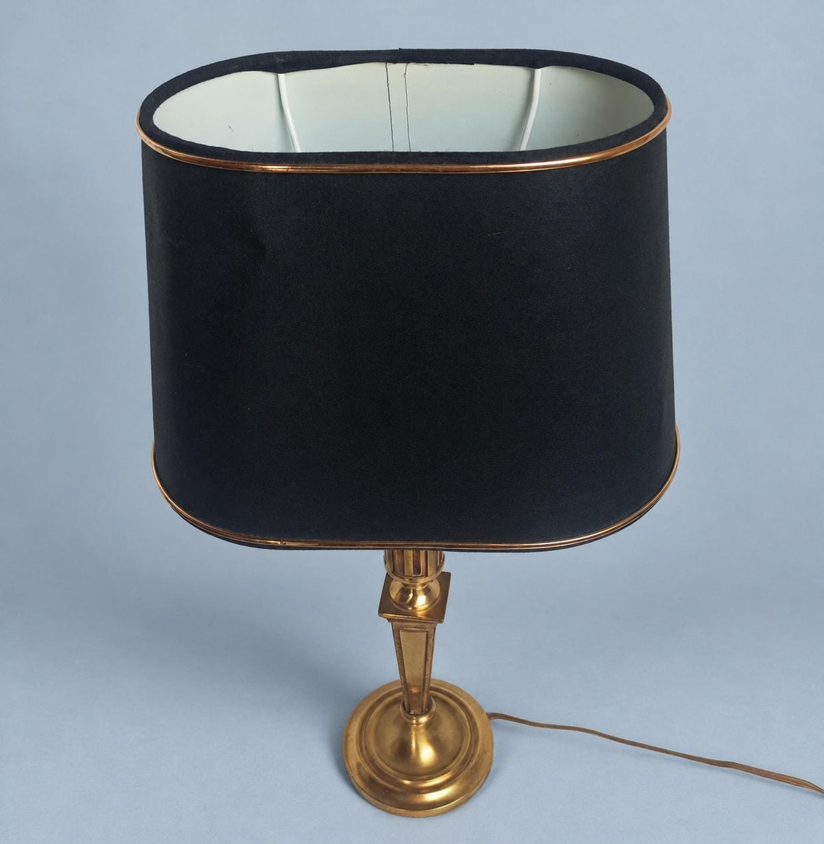 Vintage 1980s Louis XVI Style Brass-Tone Candlestick Table Lamp with Black and Gold Oval Shade
