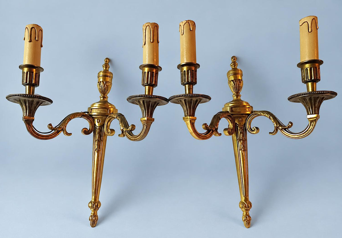 Antique Pair of Louis XVI Style Two-Arm Gilt Metal Torch Wall Sconces with Urn Finials and Beaded Drip Pans