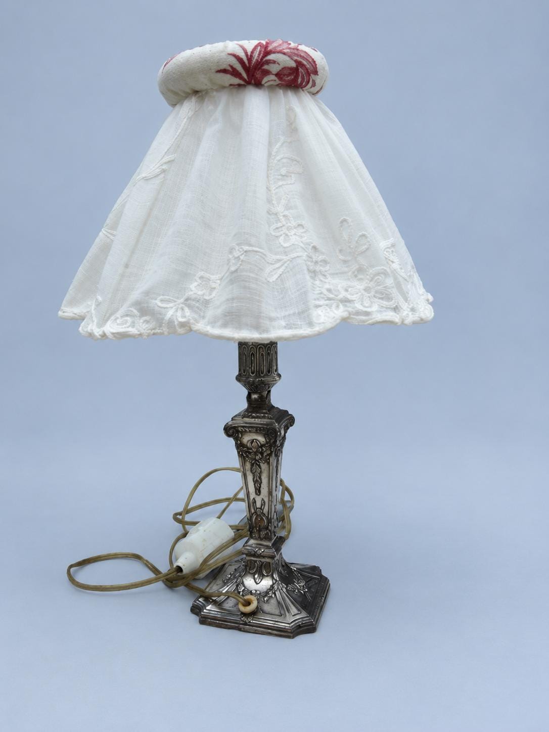 Vintage Louis XVI Style Silver-Tone Candlestick Lamp with Ribbon Garlands and Embroidered White Shade