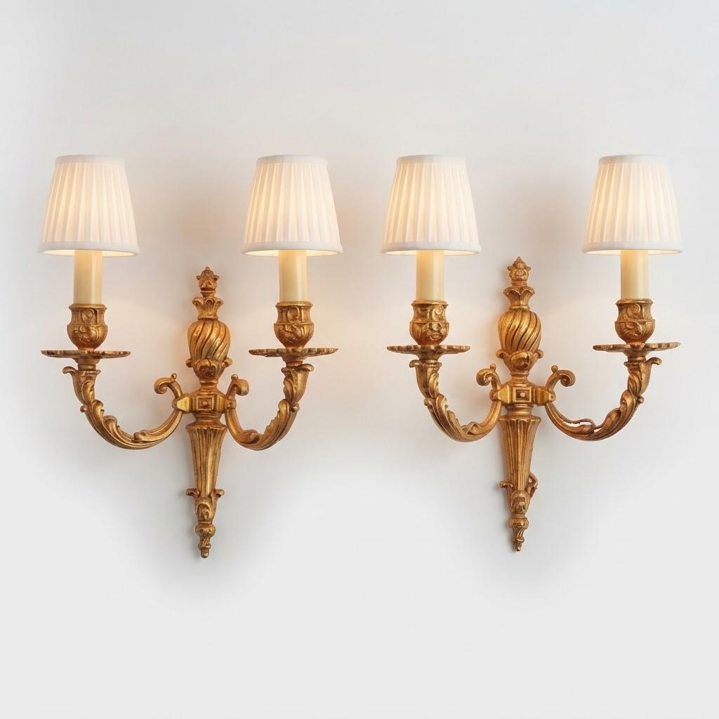 Vintage Pair of Louis XVI Style Two-Arm Gilt Metal Wall Sconces with Flame-Topped Urn and Acanthus Scroll Arms