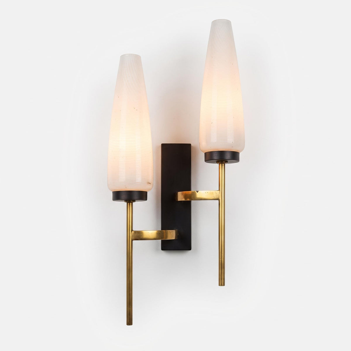 1950s Two-Light Brass Wall Sconce with Tapered White Opaline Glass Shades and Black Backplate