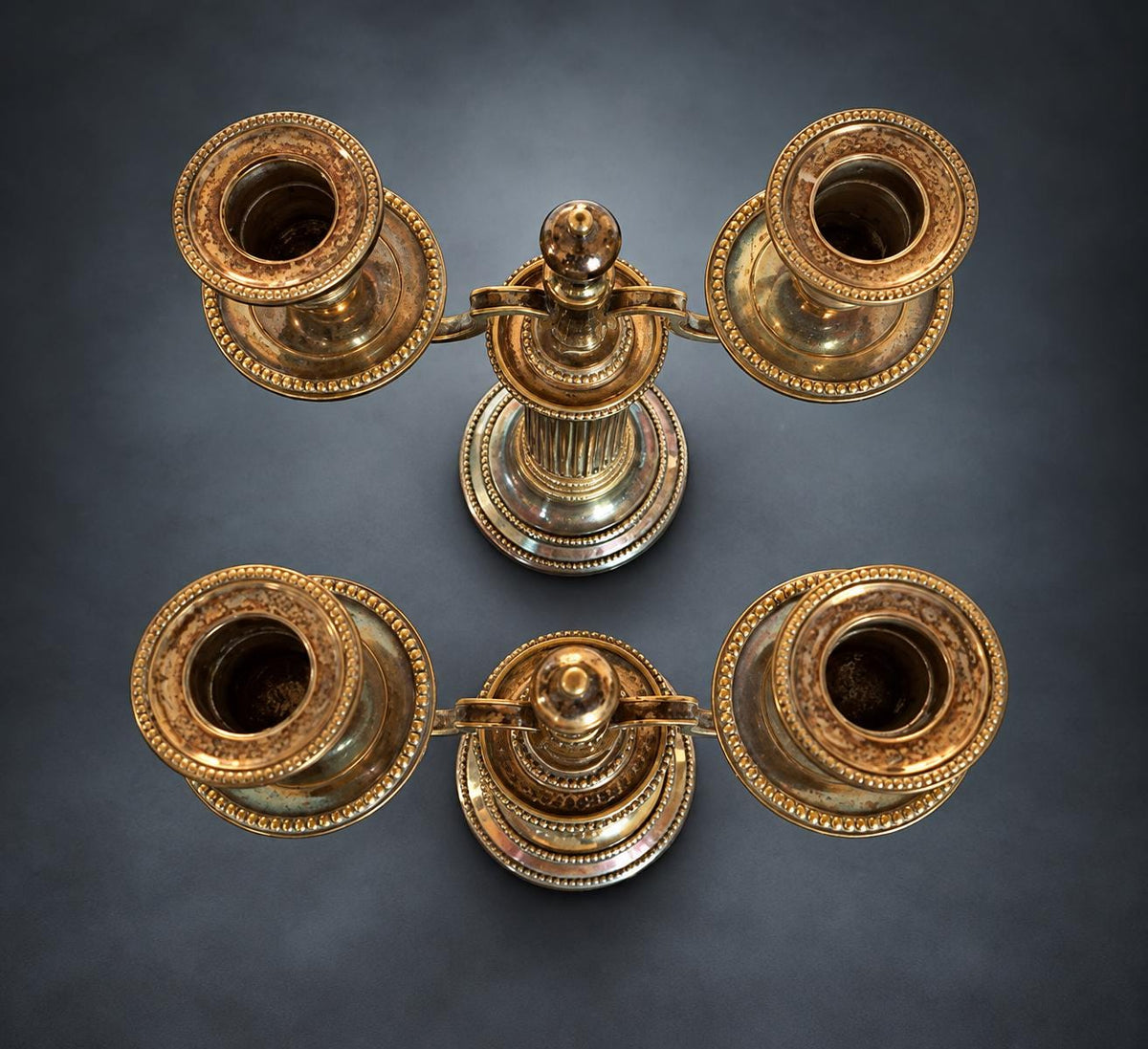 Pair of Louis XVI Style Two-Light Candelabra, Silver-Tone Metal, Fluted Columns, Beaded Round Bases, Urn Finials