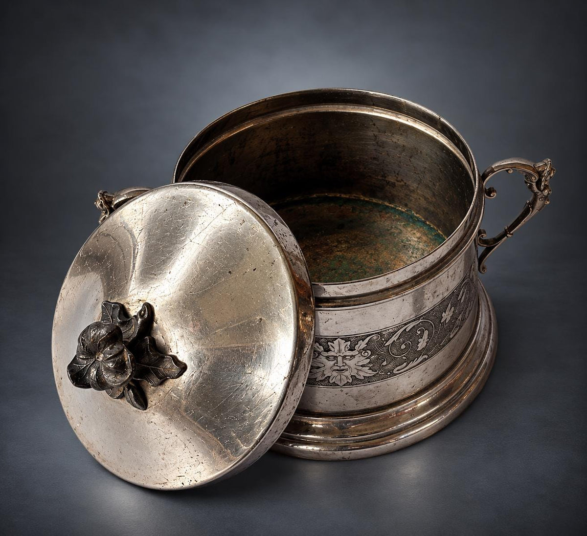 Lidded Bonbonnière in Silver-Tone Metal, Embossed Mask and Scroll Band, Figural Handles, Leaf Finial, Renaissance Revival Style