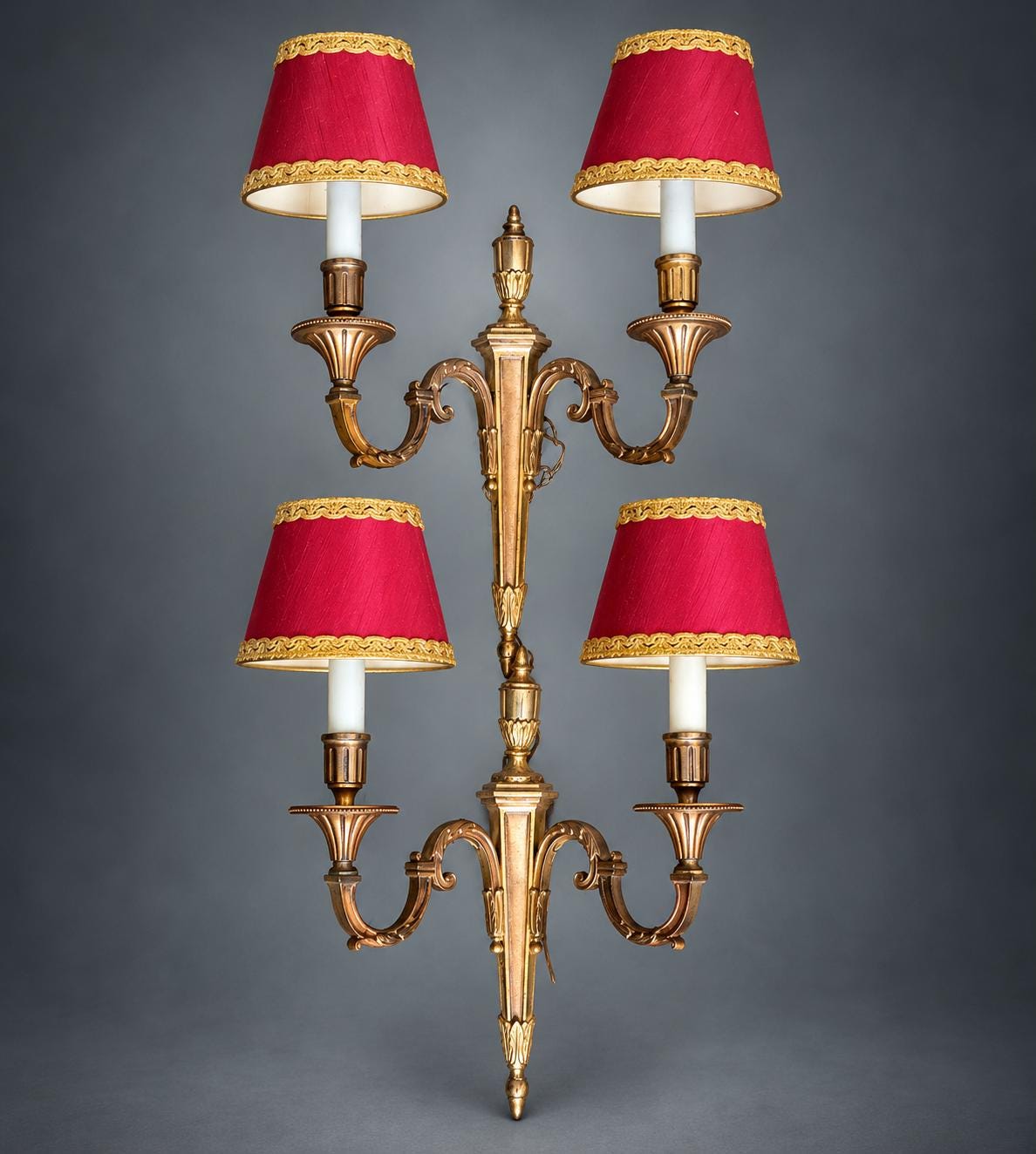 Pair of Louis XVI Style Two-Arm Wall Sconces, Gilt Metal with Urn Finials, Four Red Clip-On Shades with Gold Braid