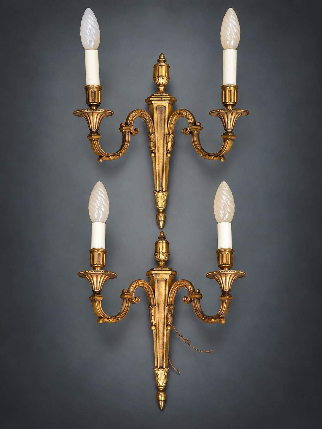 Pair of Louis XVI Style Two-Arm Wall Sconces, Gilt Metal with Urn Finials, Four Red Clip-On Shades with Gold Braid
