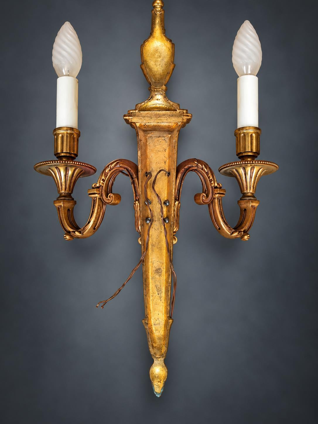 Pair of Louis XVI Style Two-Arm Wall Sconces, Gilt Metal with Urn Finials, Four Red Clip-On Shades with Gold Braid