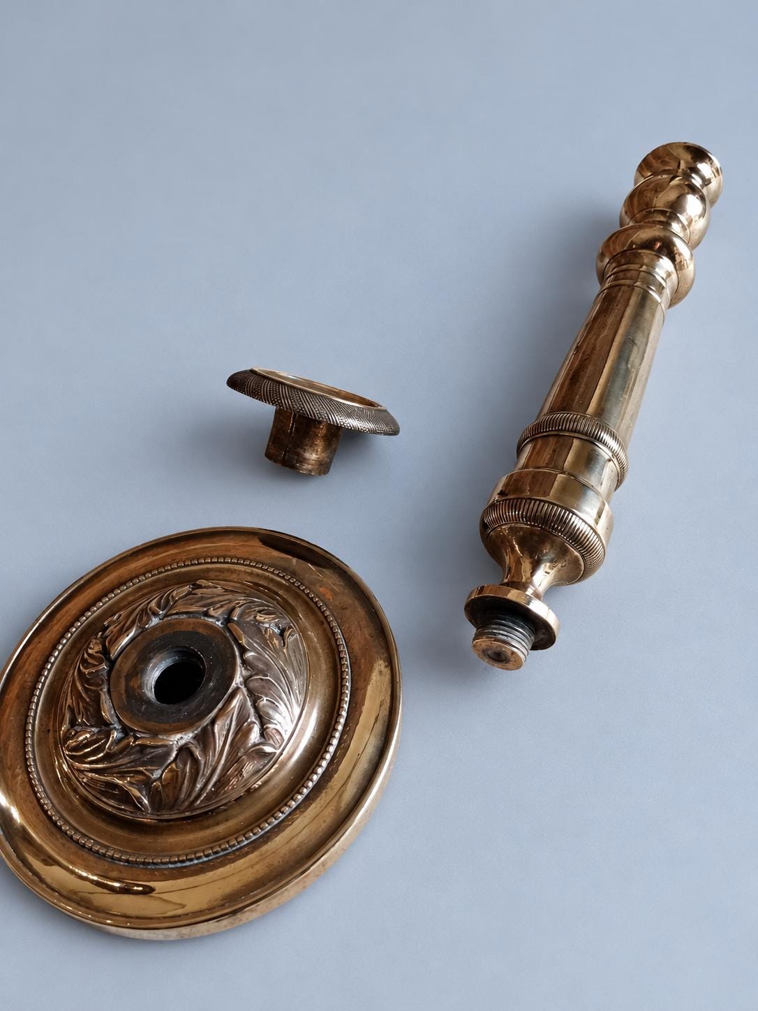 Vintage Small Pair of Empire Style Column Candlesticks, Polished Gold-Tone Metal with Leaf-Decorated Bases, 24 cm