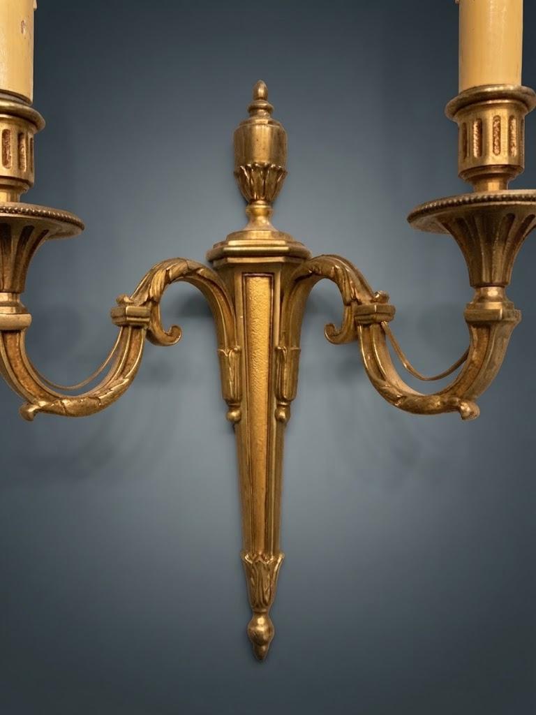 Pair of Louis XVI Style Two-Arm Wall Sconces, Gilt Metal with Scrolled Arms, Beaded Drip Pans and Urn Finials
