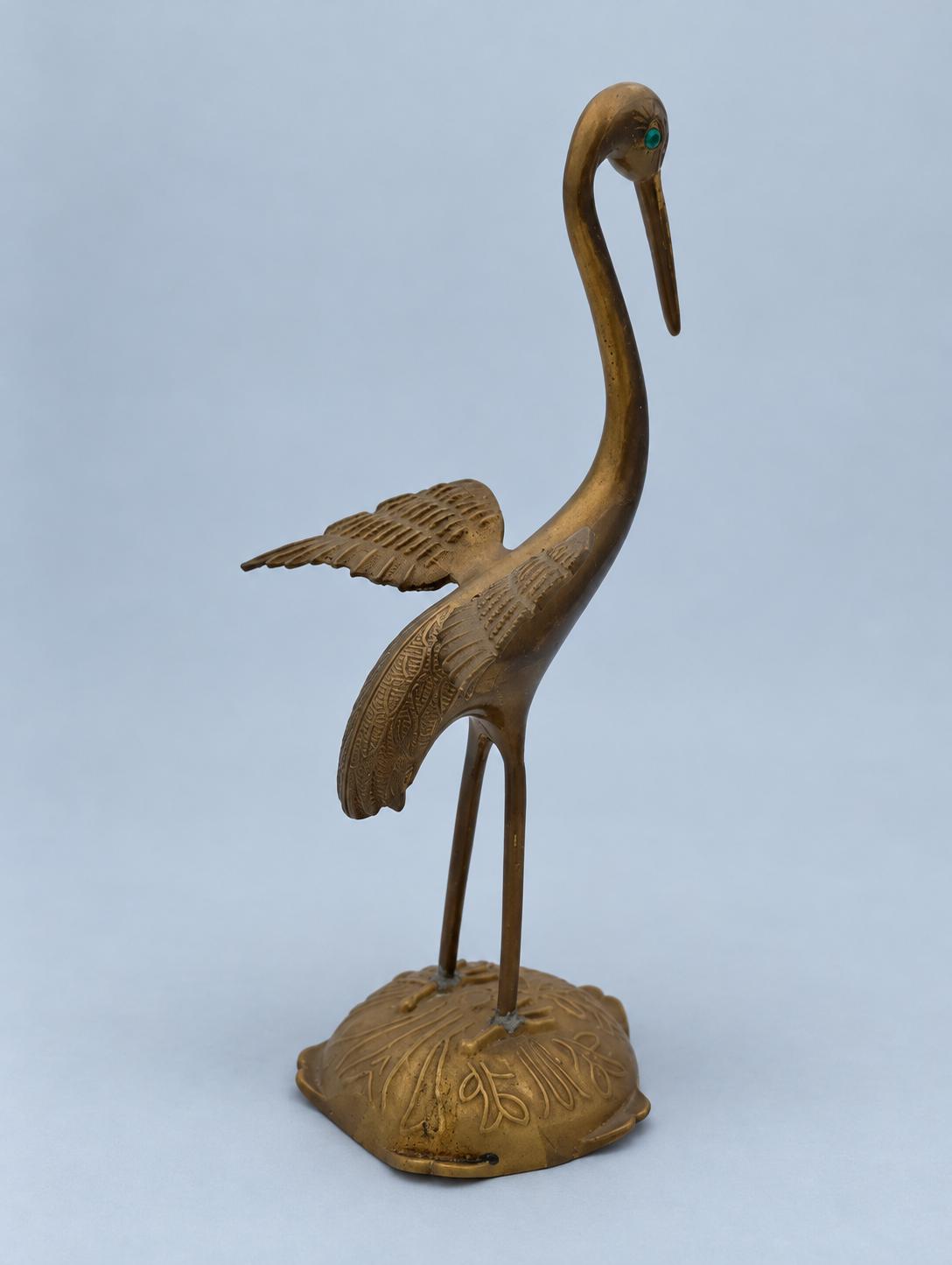Vintage Brass Crane Figurine with Spread Wings and Green Eyes, Marked Portugal, Engraved Feather Detail on Leaf-Cast Base, 24 cm