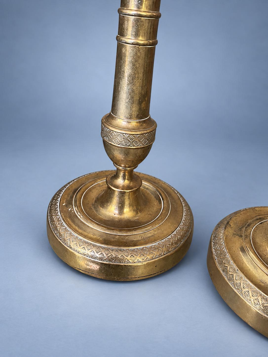 Antique Pair of Empire Style Brass-Tone Candlesticks with Ringed Shafts and Chased Diaper Bands, 19th Century