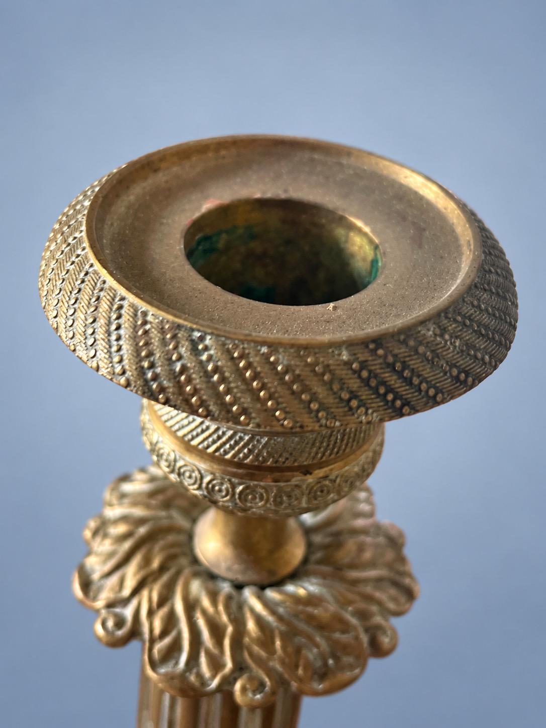 Vintage Pair of Empire Style Patinated Brass-Tone Candlesticks, Fluted Columns, Acanthus Collars and Foliate Bases