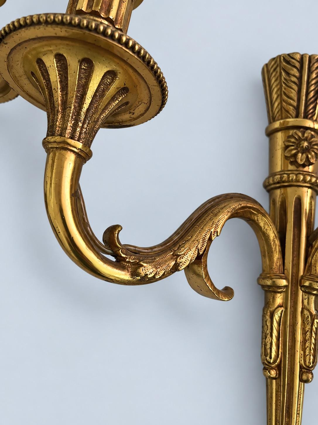 Vintage Pair of Louis XVI Style Gilt Metal Two-Arm Wall Sconces with Fluted Shaft and Rosettes