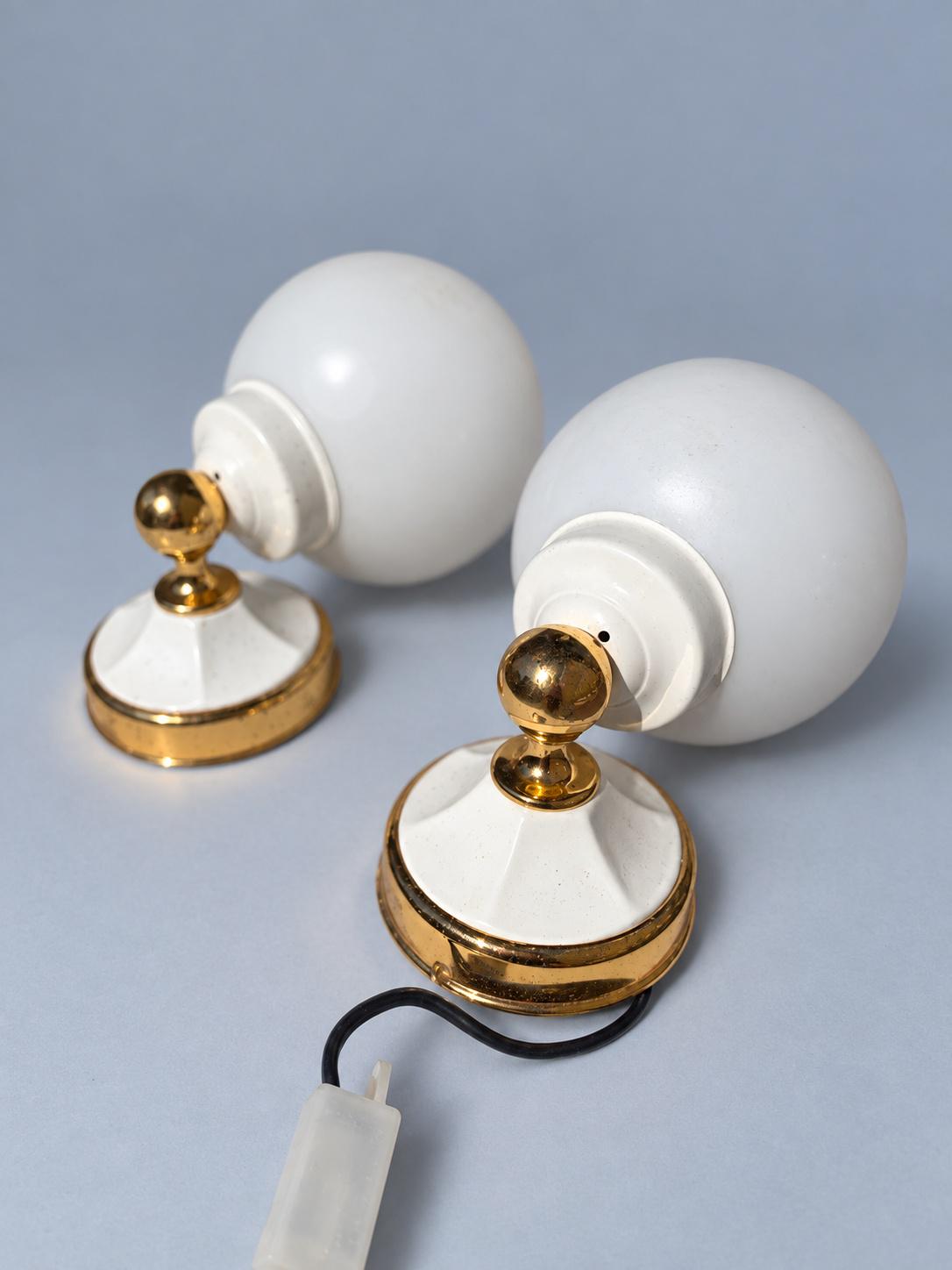 Vintage Pair of Hollywood Regency Style White and Gold-Tone Globe Wall Sconces