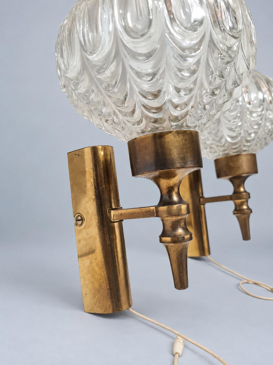 Vintage Pair of 1950s Brass-Tone Wall Sconces with Clear Teardrop-Pattern Glass Shades and Pull Cords