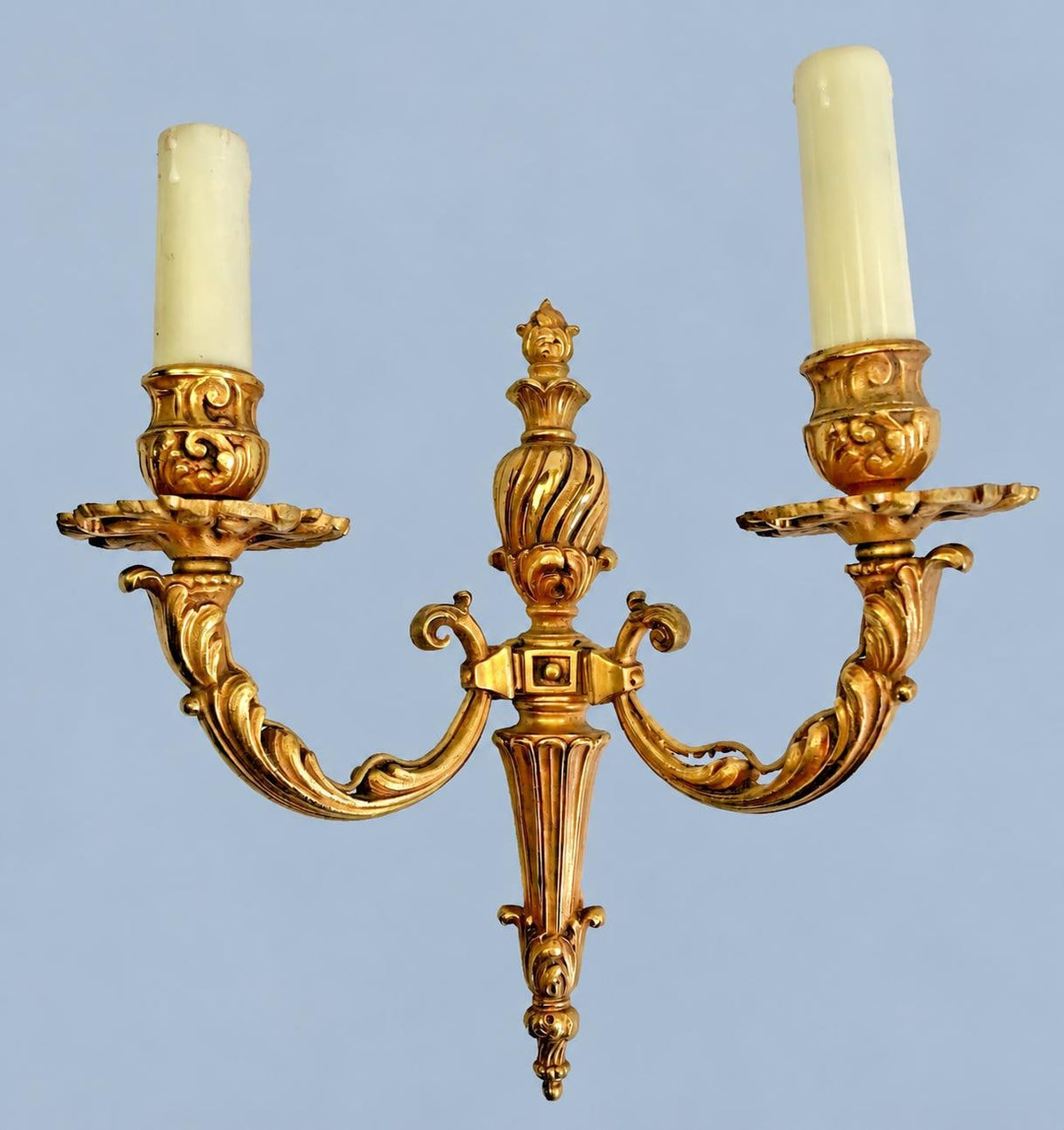 Vintage Pair of Louis XVI Style Two-Arm Gilt Metal Wall Sconces with Flame-Topped Urn and Acanthus Scroll Arms