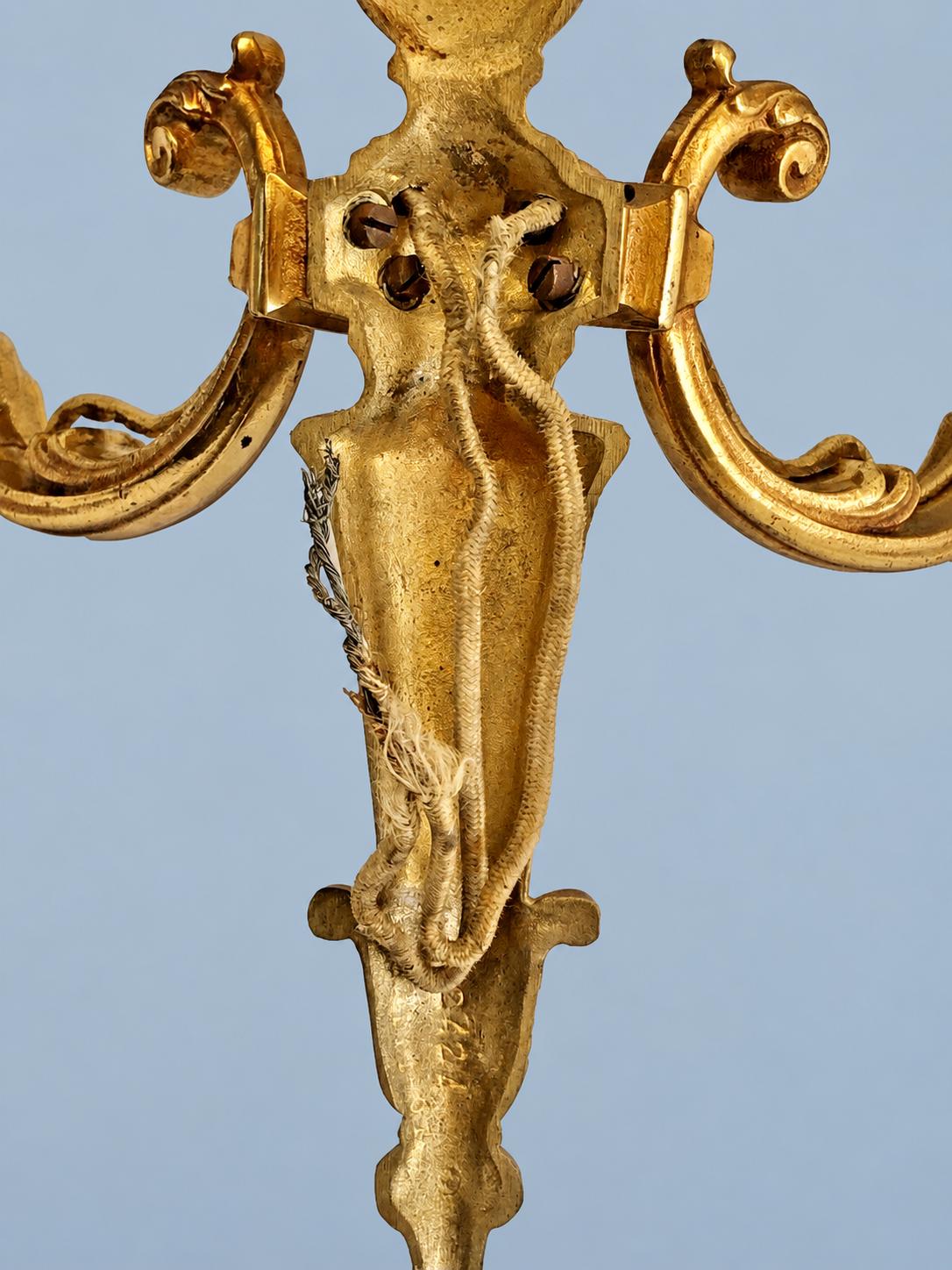 Vintage Pair of Louis XVI Style Two-Arm Gilt Metal Wall Sconces with Flame-Topped Urn and Acanthus Scroll Arms