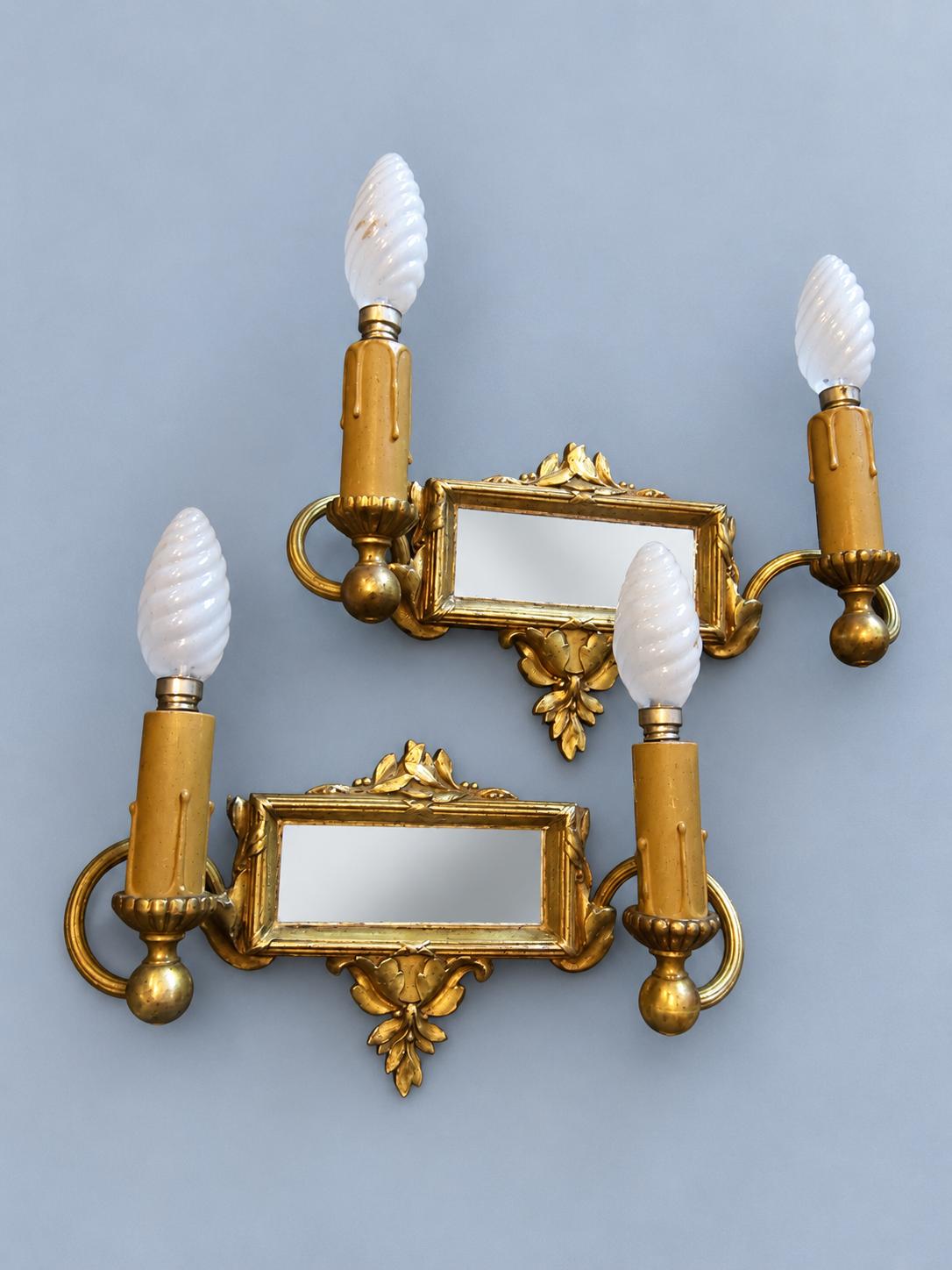 Vintage Pair of Louis XVI Style Two-Arm Gilt Metal Mirror Wall Sconces with Laurel Crests